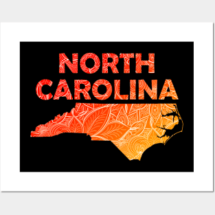 Colorful mandala art map of North Carolina with text in red and orange Posters and Art